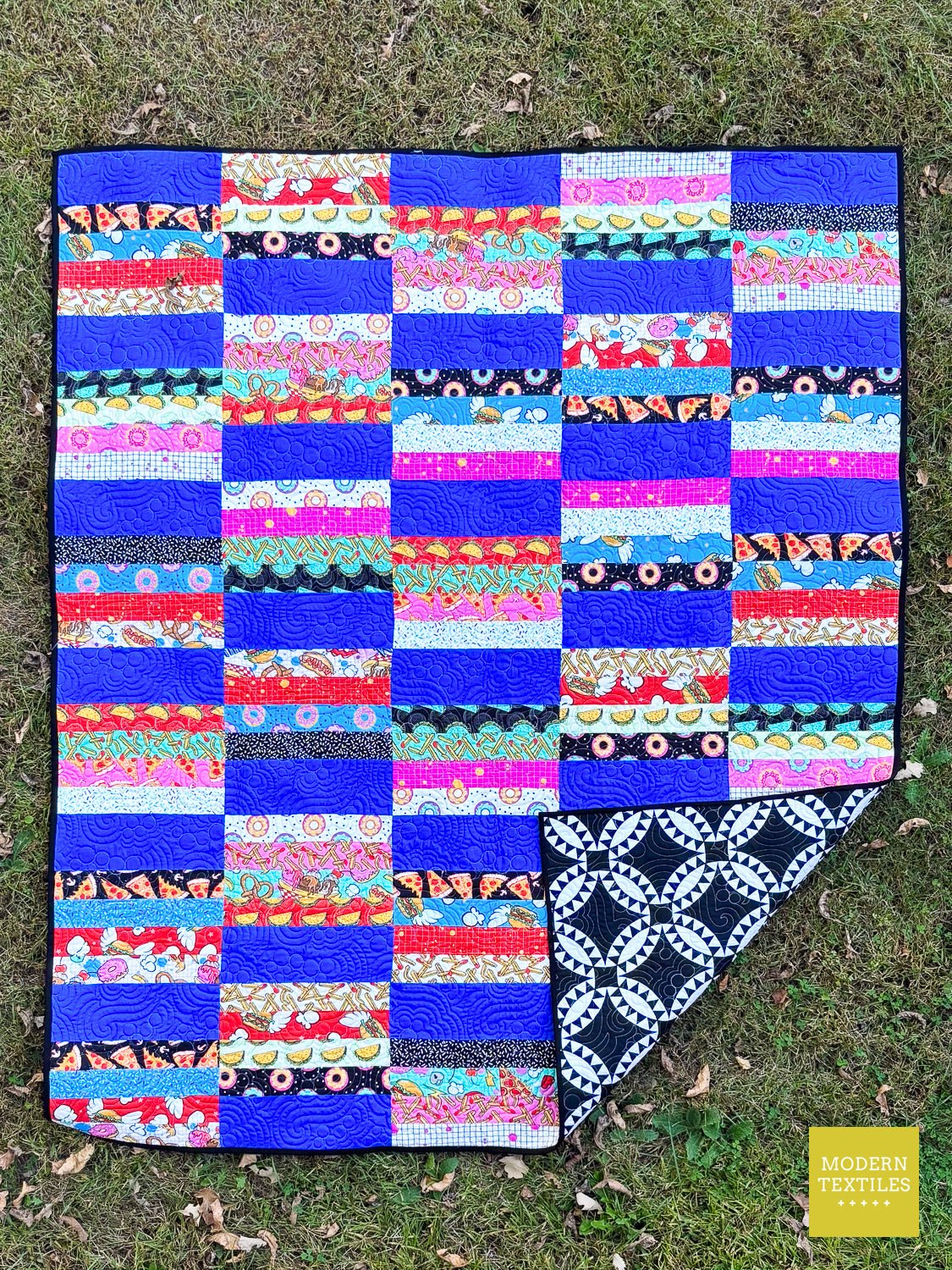 Finished Hannah Quilt pattern quilted with the Grape Soda pantograph and colorful modern fabrics.