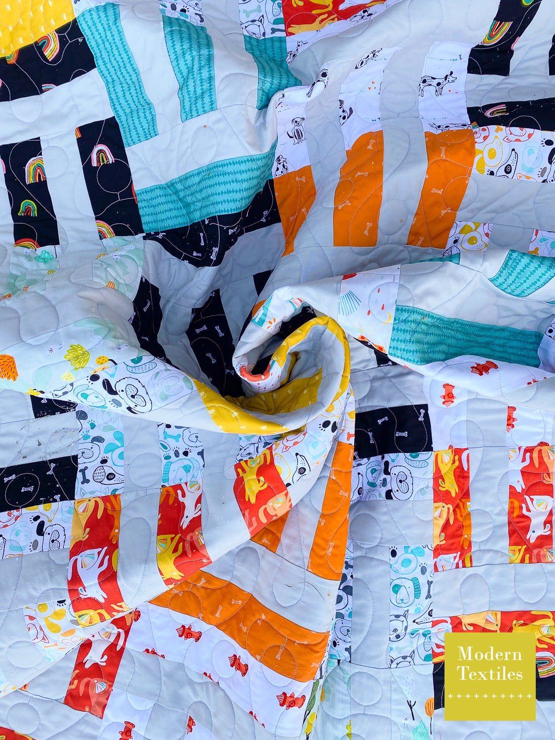 Twisted close-up of Cake Weave quilt highlighting fabric movement and geometric design.