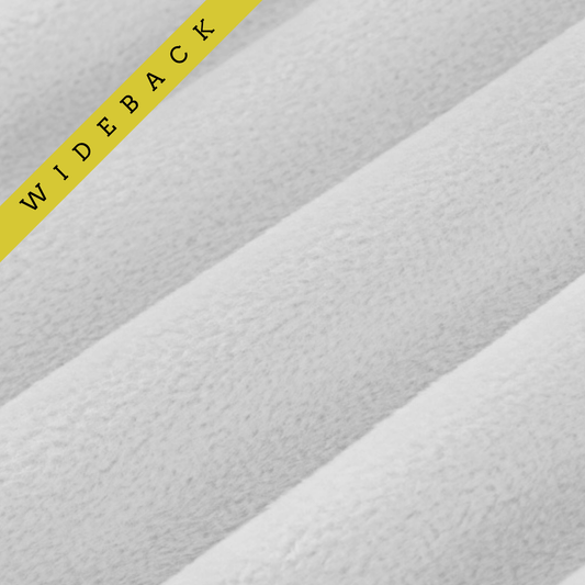 Soft 90 wide minky in light grey color, folded onto itself to show dimension. Text overlay of wideback in corner.