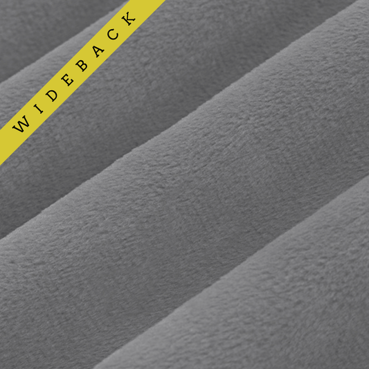 Soft 90 wide minky in dark grey color, folded onto itself to show dimension. Text overlay of wideback in corner.