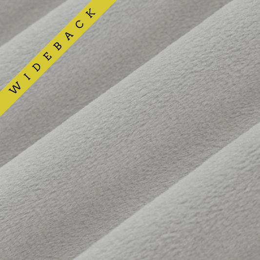 Soft 90 wide minky in medium grey color, folded onto itself to show dimension. Text overlay of wideback in corner.