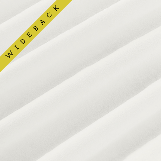 Soft minky in white, folded onto itself to show dimension. Text overlay of Wideback in corner.