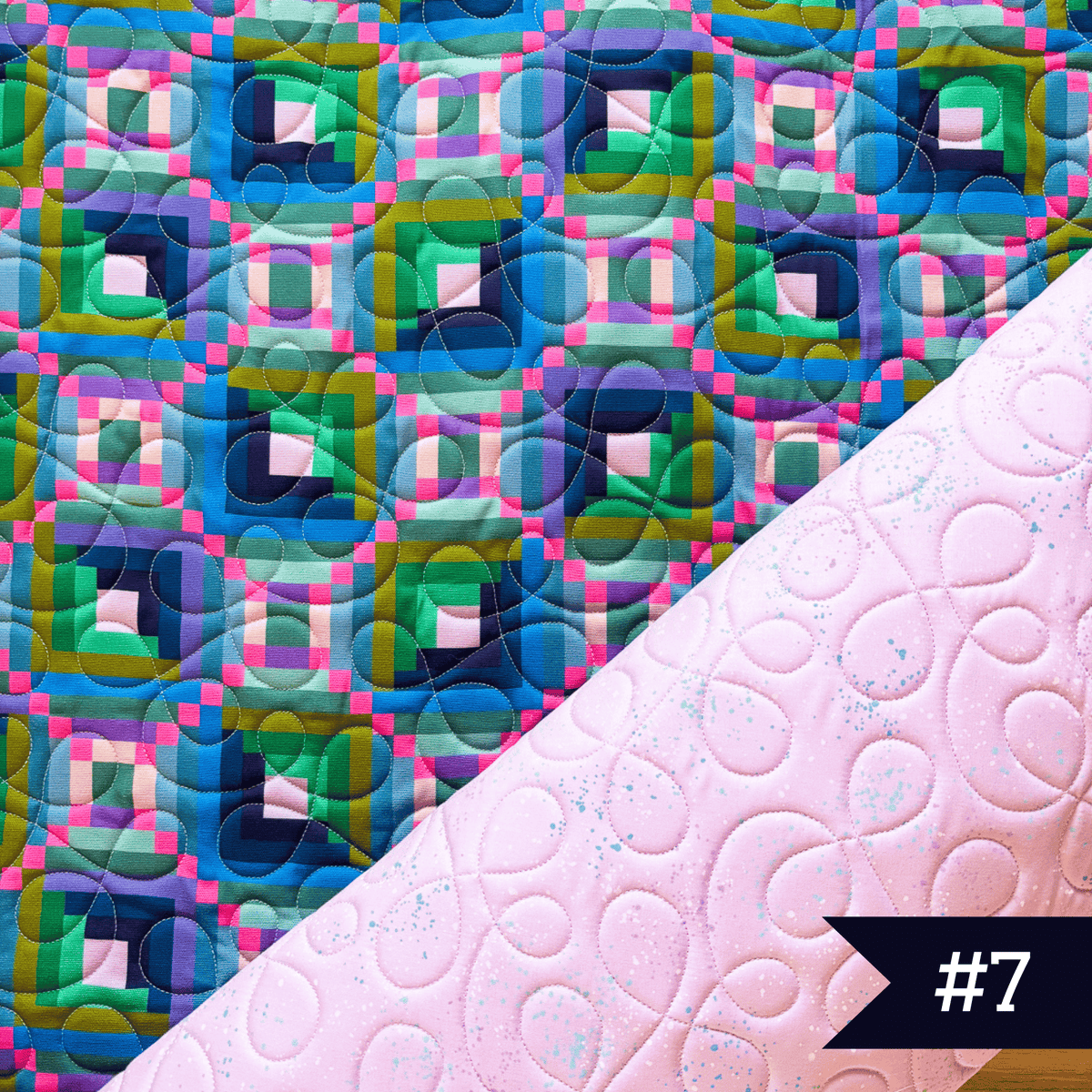 Quilted fabric using Canva and Co fabric with speckled fabric in light purple with cakewalk quilting design. #7 noted in lower right corner.