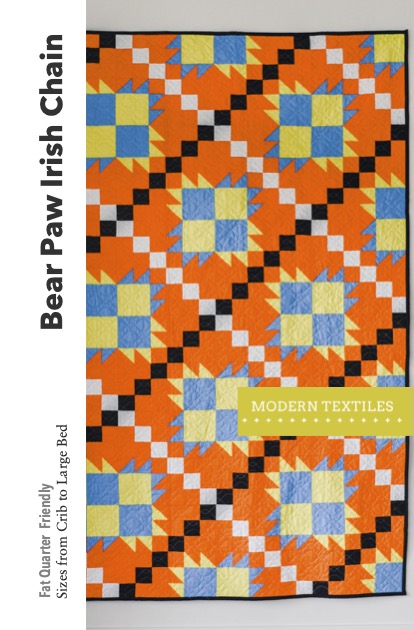 Bear Paw Irish Chain quilt pattern cover in orange with black and white chains and green and blue bear paws. Text overlay reads: Bear Paw Irish Chain, Fat Quarter Friendly, sizes from crib to large bed. Modern Textiles logo on right hand side.