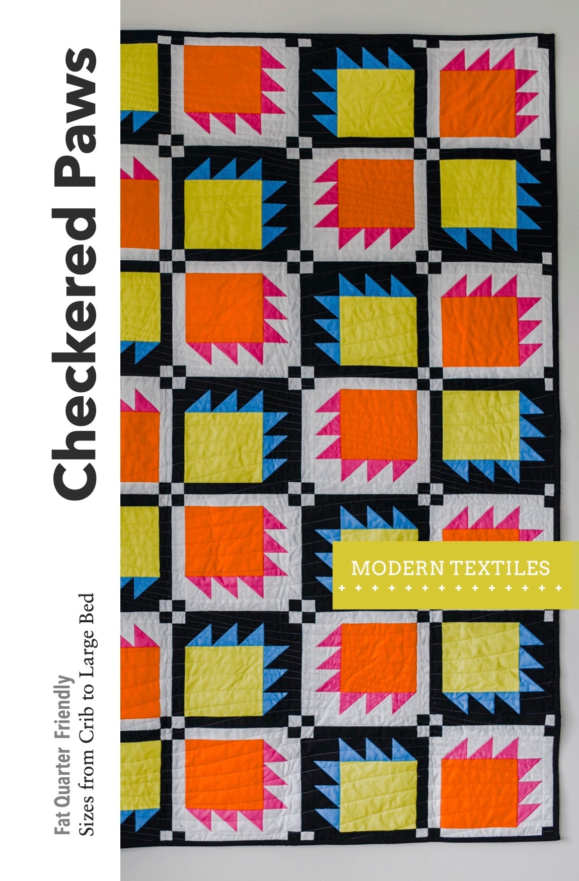 Colorful quilt with geometric pattern on a white background, featuring the brand 'Checkered Paws'.