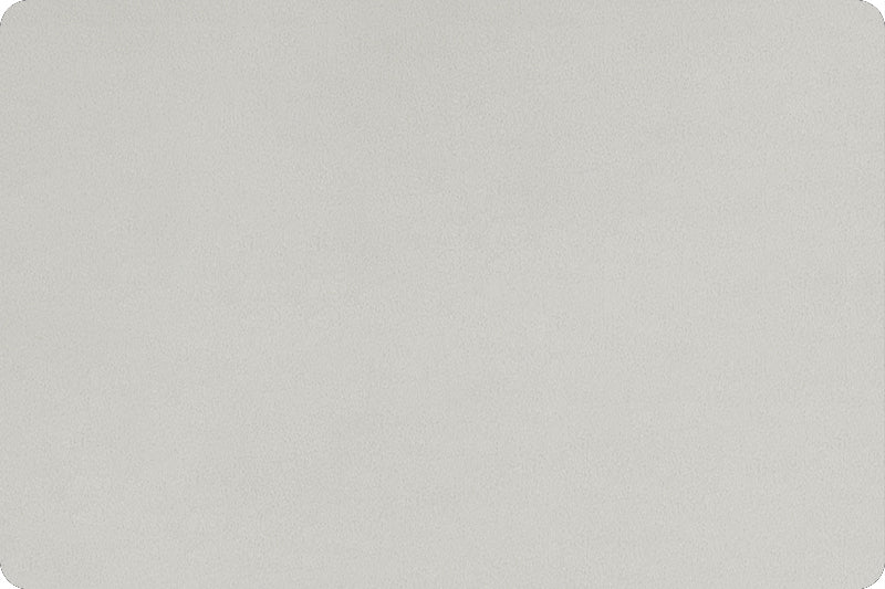Flat lay of soft 90 wide minky in light to medium grey color, folded onto itself to show dimension.