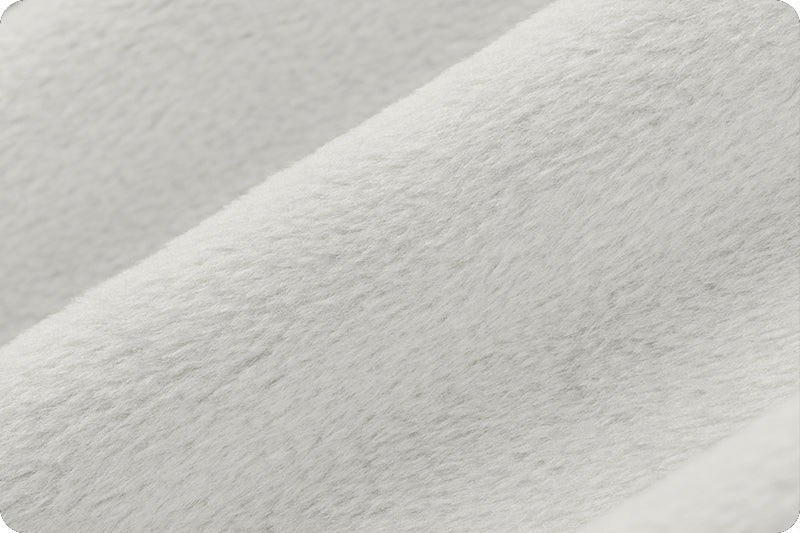 Close up of soft 90 wide minky in light to medium grey color, folded onto itself to show dimension.