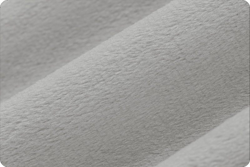 Close up of 90 wide minky in medium grey color, folded onto itself to show dimension.
