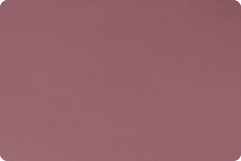 Flat Lay of 90 Wide minky in deep medium pink color, folded onto itself to show dimension.