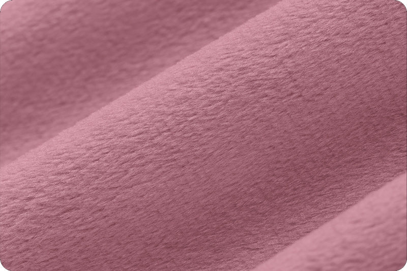 Close up of 90 Wide minky in deep medium pink color, folded onto itself to show dimension.