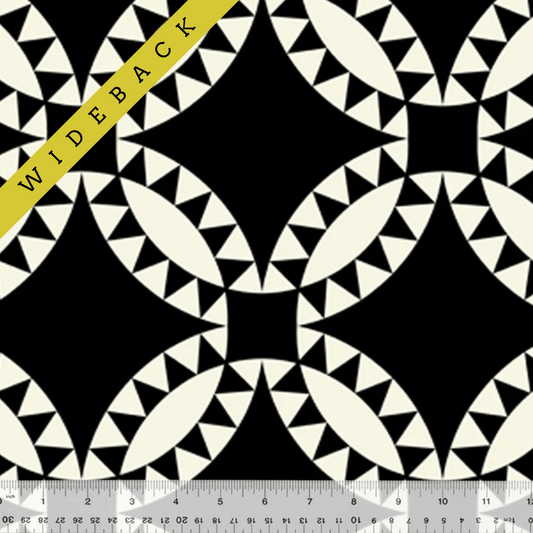 Geometric black and white print with triangles spaced to make larger circular print.