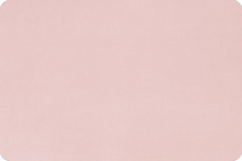 Flat lay of light pink minky fabric with soft texture shown.